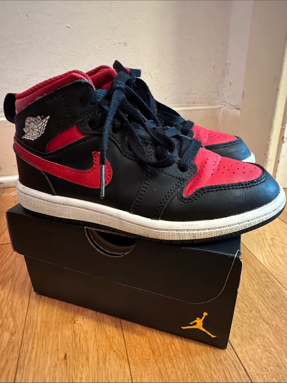 Black red and white Nike JORDAN MID 1
